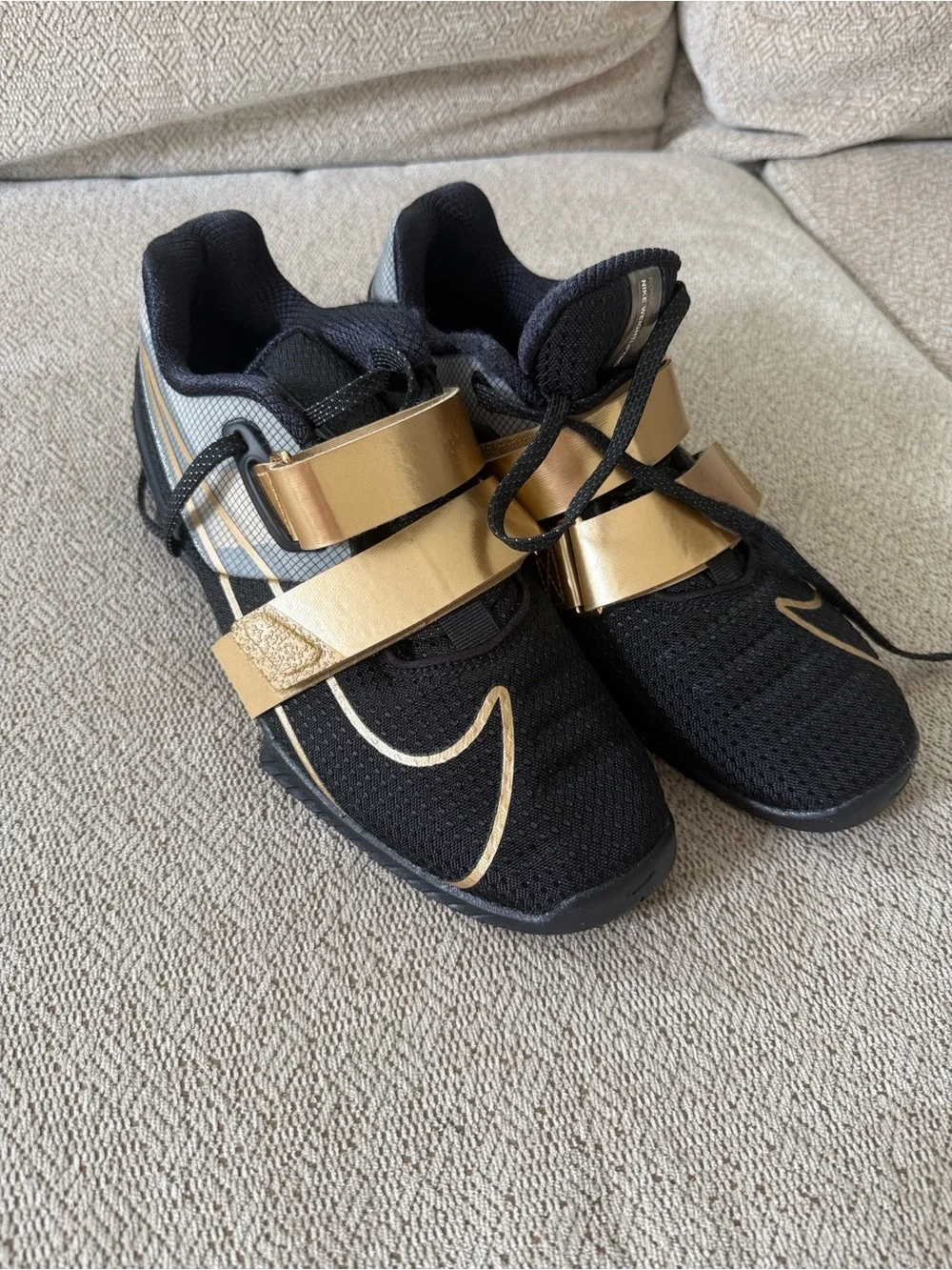 Nike Black Athletic Shoes with Metallic Gold Straps